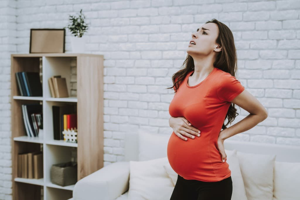 Back on Track: Coping with Pregnancy-Related Back Pain - Glo Mama